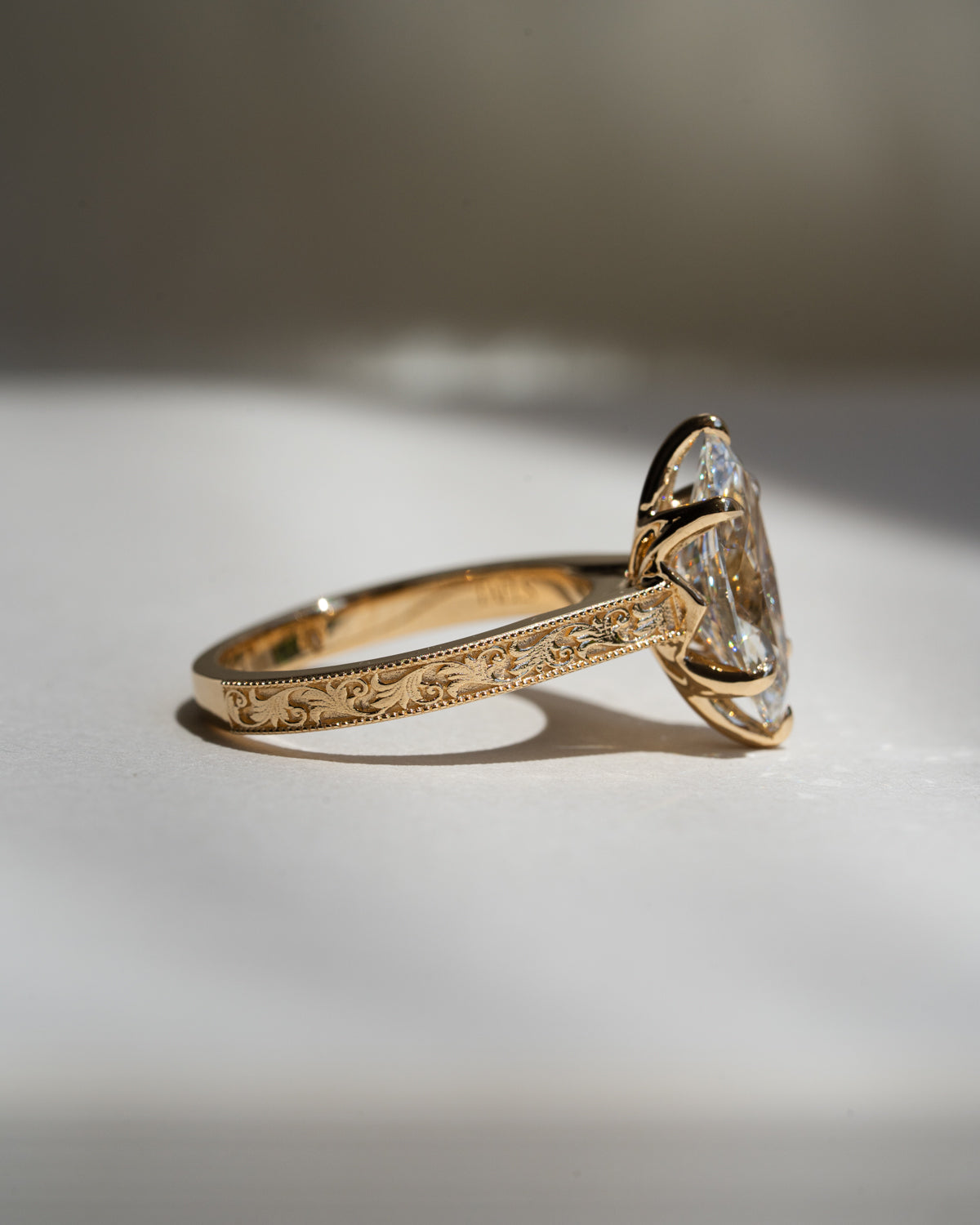 Marquise diamond with floral filigree band