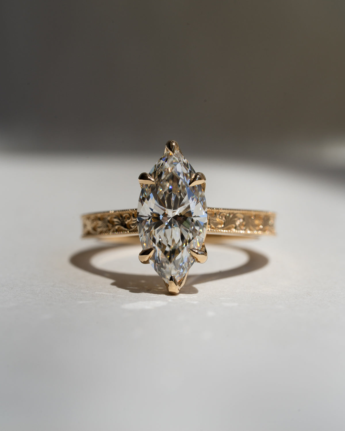 Marquise diamond with floral filigree band
