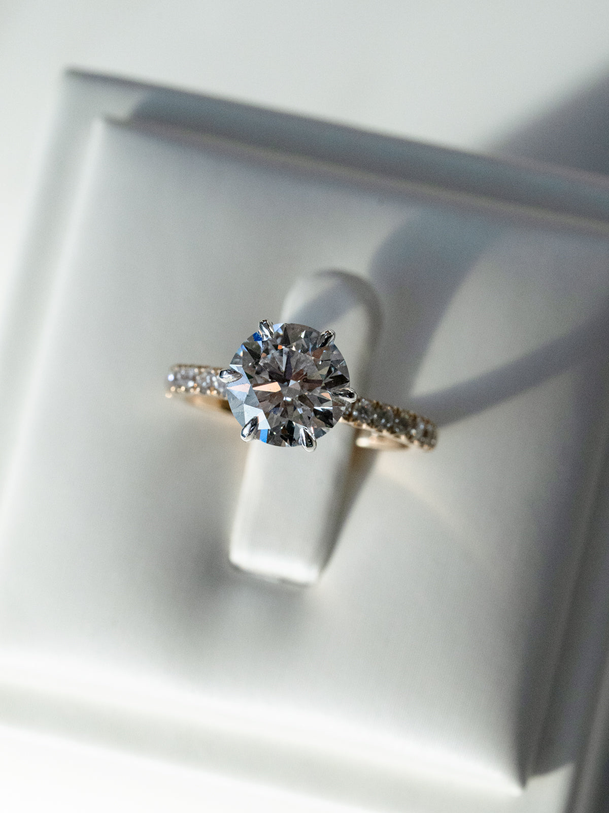 Front view of 2.3ct round diamond solitaire engagement ring in platinum and yellow gold two-tone setting