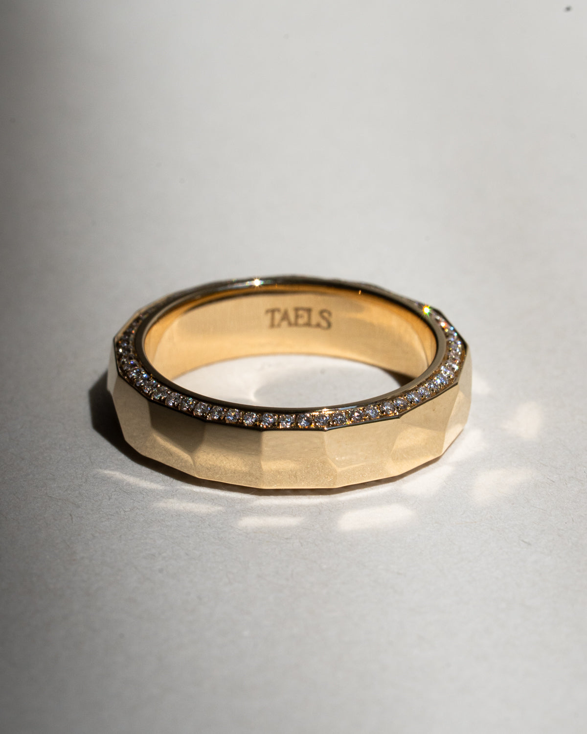 Hammered gold band with pavé diamonds