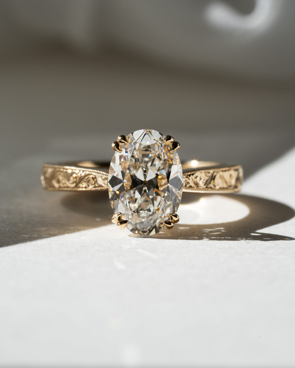 Old mine oval with hand-engraved scroll band
