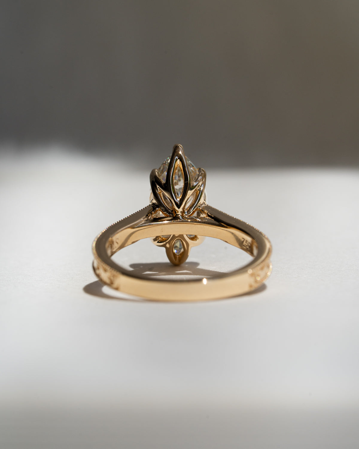Marquise diamond with floral filigree band