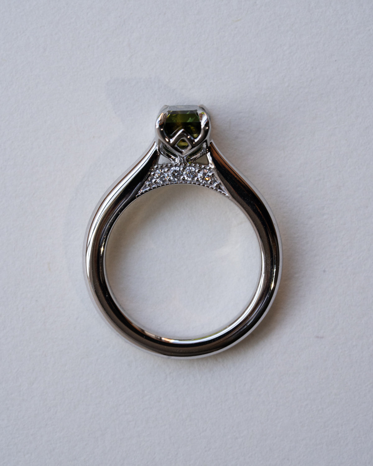 Emerald cut parti sapphire with diamond bridge, milgrain with diamonds on pridge