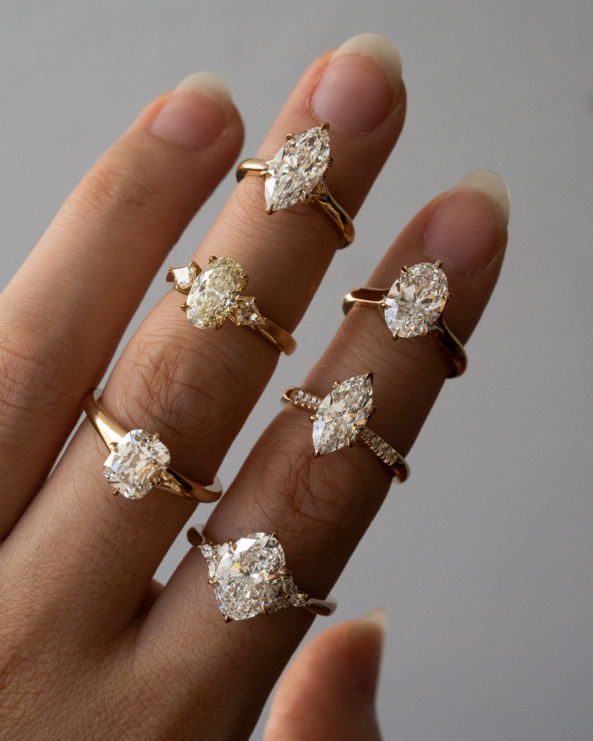 Marquise diamond with pavé shoulders and floral engraving