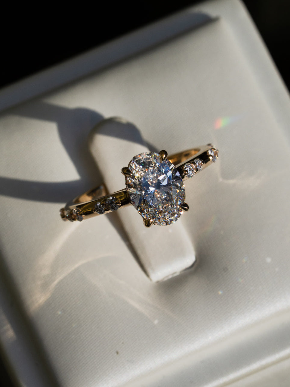 Oval Diamond Ring with Hidden Halo and Cathedral Setting