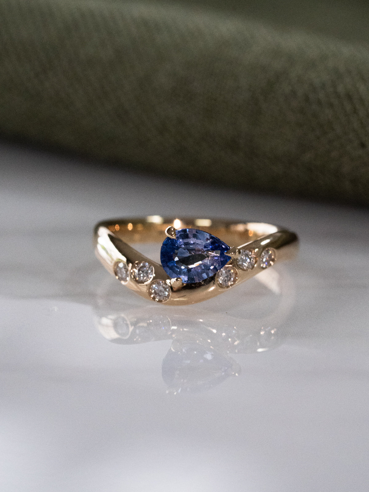 Blue Sapphire Wave Ring with Scattered Diamonds